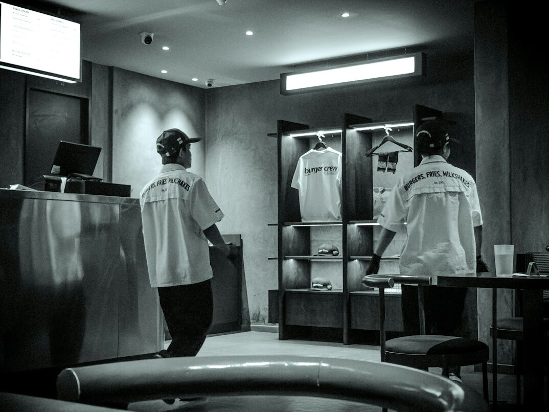 store security guard watching customer