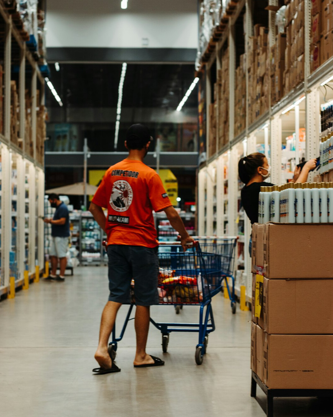 supermarket aisle with shoppers